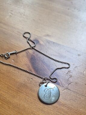 Tiffany & Co. Engraved 'F' Round Pendant Necklace in Silver
